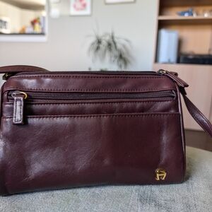 Burgandy Leather Crossbody Bag with Multiple Compartments and Metal Hardware